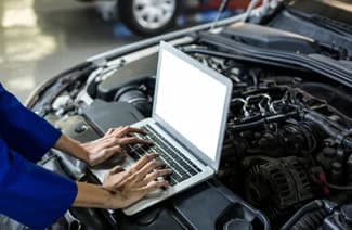 A mechanic with a clipboard